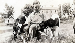 Milton R. Holloway with twin calves