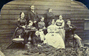 Children of Edward Wright & Harriott Buer c1864: Back: Emma (1841); Joshua (1848); Charles (1855) Middle: Richard (1859, seated at desk) with Jane (1858) Front: On empty chair, photo of Ann (1844), already married; Ellen (Nellie 1846) holding hand of Fann
