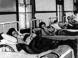 Mary Mallon (foreground) in a hospital bed during her first quarantine