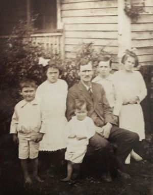 James Henry Wyatt with children  Minnie, Arthur and grandson Eugene