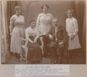 Charles & Sarah De'ath posing with daughters