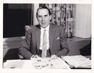 John Innes Elliott at his desk