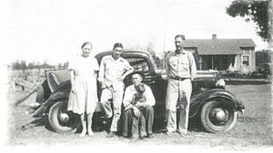 Rogers family in front of home