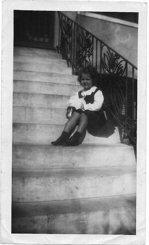 Sissy on the steps of her home.