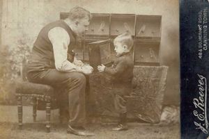John Edward Reeves showing his son Eddie his canaries