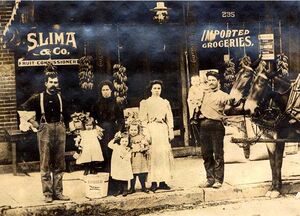 Sam Lima and family in front of their store