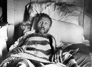 Father Damien on his death bed.