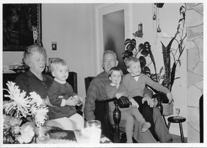 Willem Spaargaren with grandchildren Henk Willem and Karen on his lap and Antje with the third grandchild Marian on her lap.