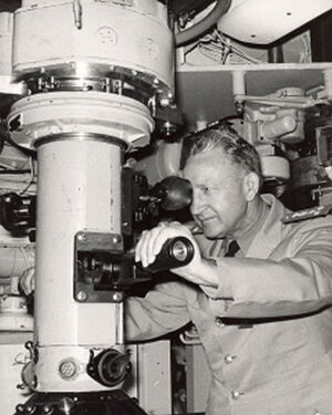 VAdm Claude Ricketts, newly appointed Vice Chief of Naval Operations, mans the periscope of the Ethan Allen (SSBN-608).