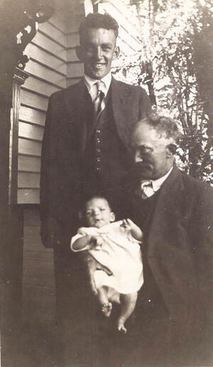 Three generations. Ron standing and Bob with baby Ian in his arm.