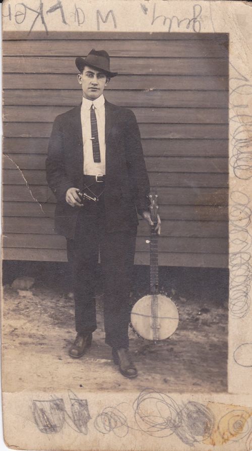 My grandmother's step-brother, Edward Starling (Herrage) Davidson. Not sure why he needs the gun - to protect his banjo, perhaps??