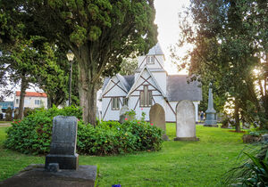 Graves and church at All Saints in Howick