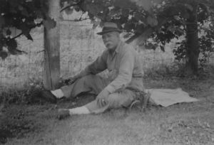John Floyd Wolfe Sitting In Yard