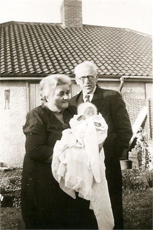 Harry and Sue Hills holding their youngest grand-daughter Christine Alice