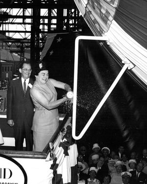 Tecumseh (SSBN-628) launching ceremony at General Dynamics Electric Boat on 22 June 1963. Left to right: Mr. J. William Jones, Jr. (President of Electric Boat) and Mrs. Robert L. F. Sikes (Sponsor) does the bubbly honor