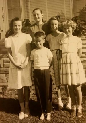 Patricia Jean Lowden on the left, Thomas Lowden in the middle-front  Maryann Lynch next to Tommy, second from the right.