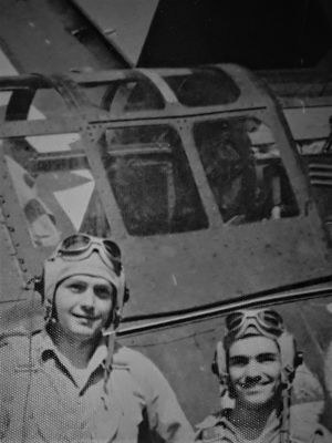 HRG Jr and his Tail Gunner, Peter F. Simon of Watertown, Mass in front of their SB2C Helldiver Bomber.